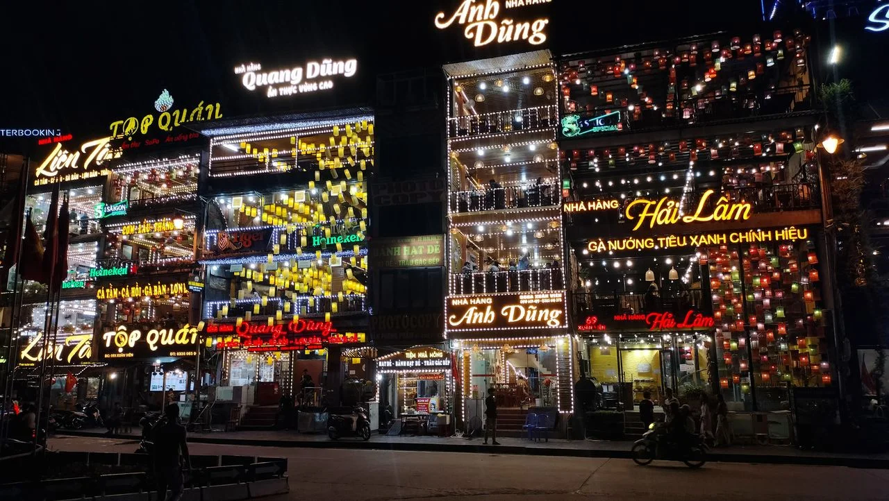 SaPa town centre lit up at night, lined with Vietnamese restaurants — Vietnam DMC by Fiesta Asia Travel