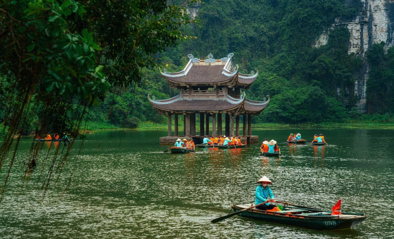 Trang An boats winding between karst cliffs at Ninh Binh, near Hanoi