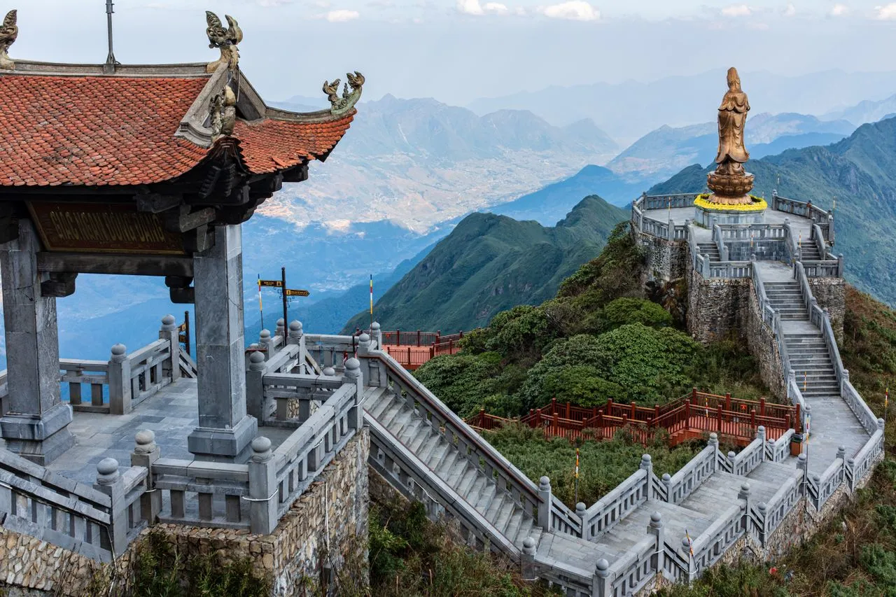 The bronze Buddha and stone stairways at the Fansipan summit above SaPa — Vietnam DMC by Fiesta Asia Travel