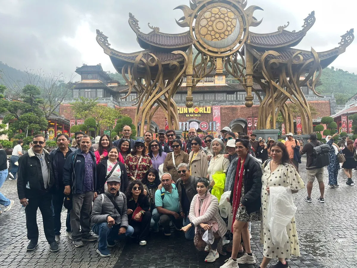 A large travel group at the Sun World Ba Na Hills gate near Da Nang, Vietnam