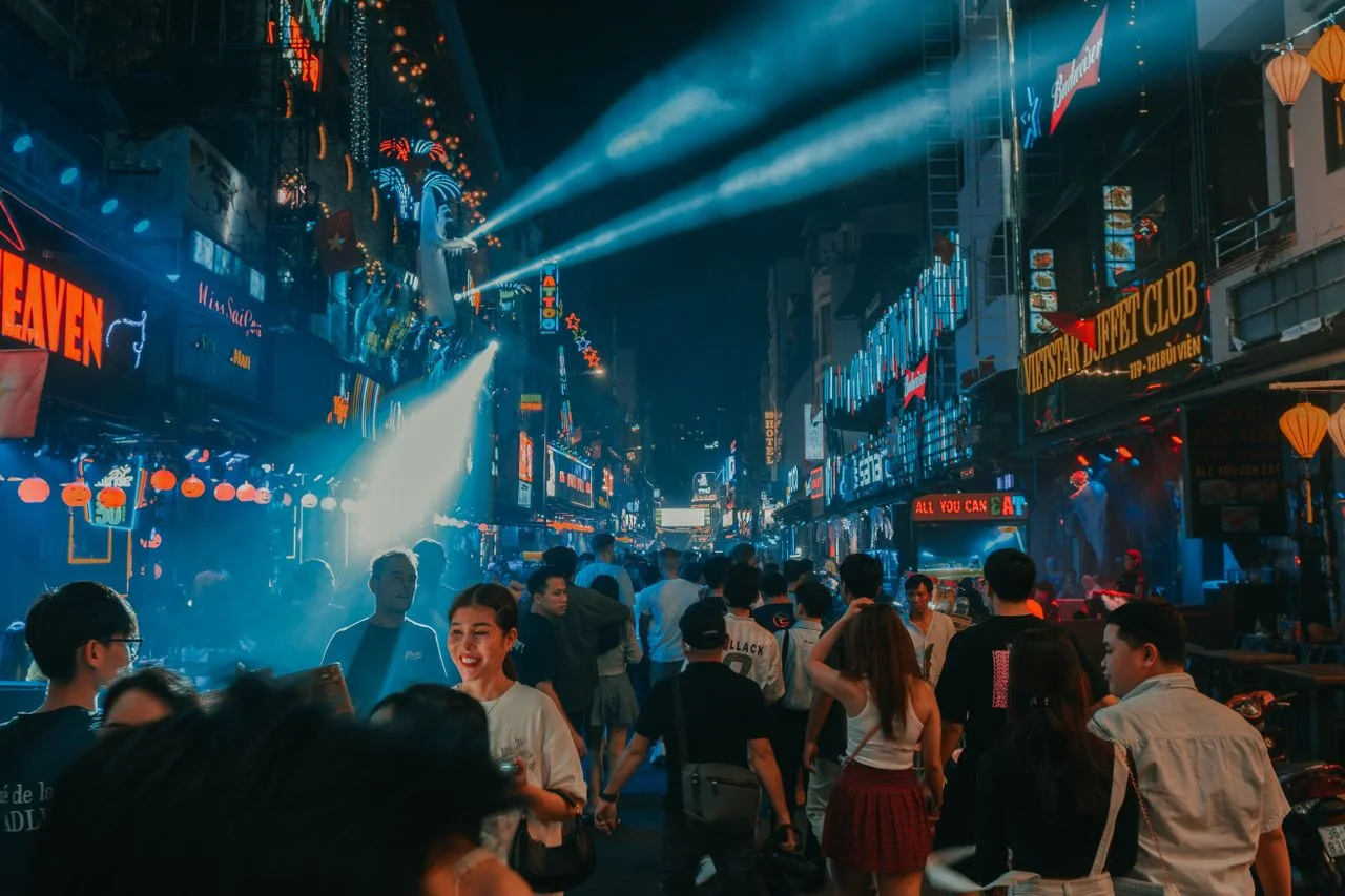 A bustling street of Ho Chi Minh City lit up at night